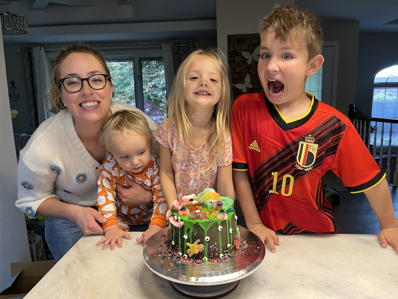 Family Kids Halloween Cake With Gummy Snakes and Eye Balls