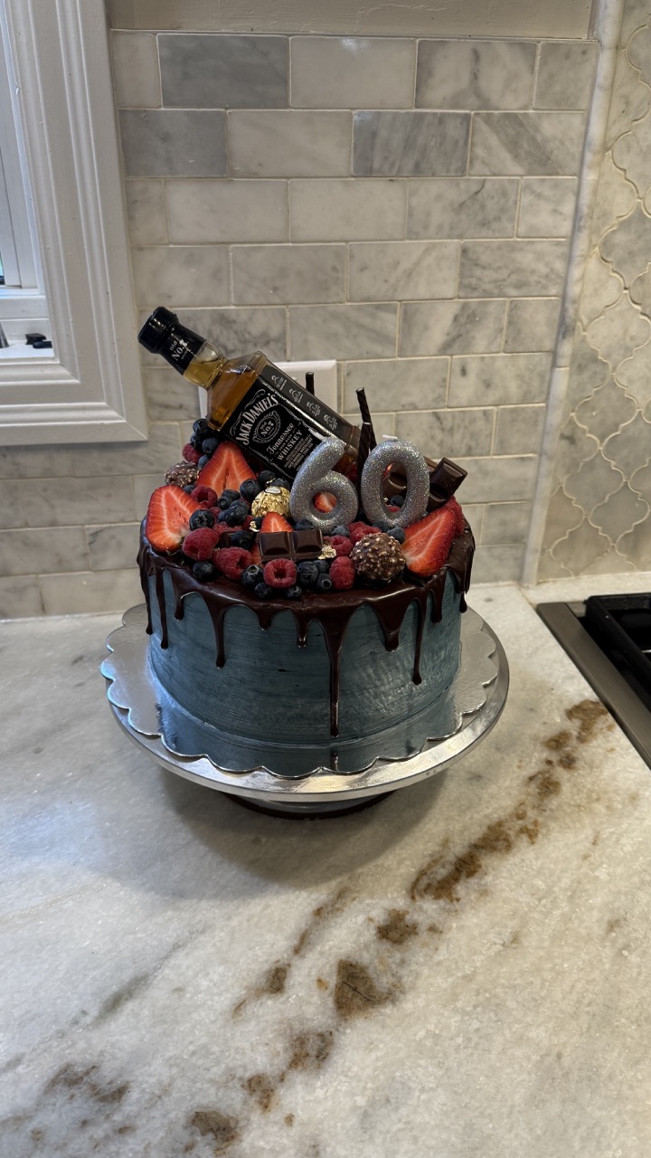 Strawberry Chocolate Birthday Cake With Whiskey Bottle On Top